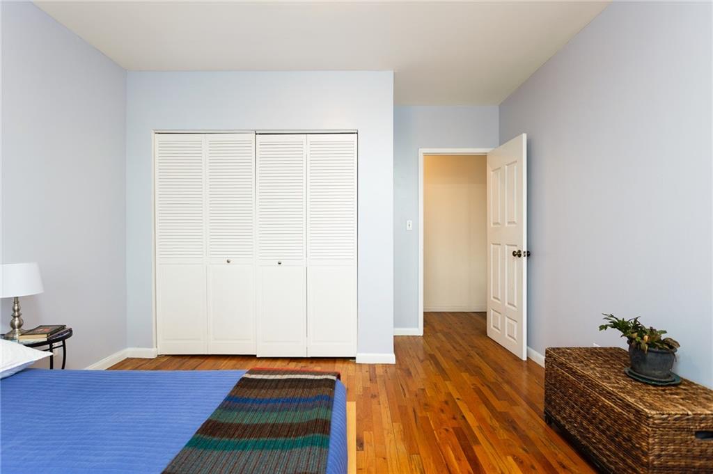 68 Stratford Road, Unit 7 Brooklyn, NY 11218 - Photo 9 of 13 a room with a bed and wooden floor