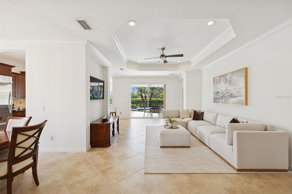 14614 Newtonmore Lane Lakewood Ranch, FL 34202 - Photo 11 of 72 a living room with furniture and a large window