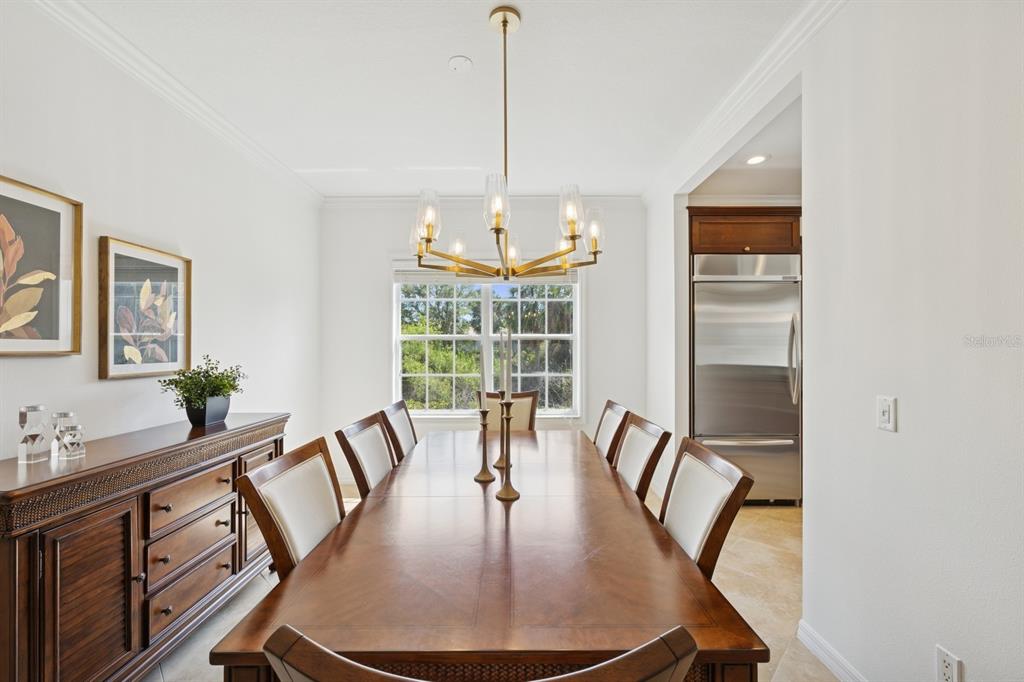 14614 Newtonmore Lane Lakewood Ranch, FL 34202 - Photo 25 of 72 a view of a dining room with furniture window and outside view
