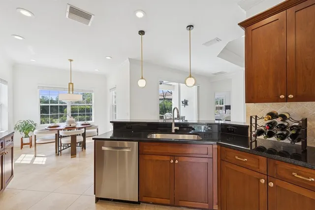a large bedroom with a bed and a chandelier