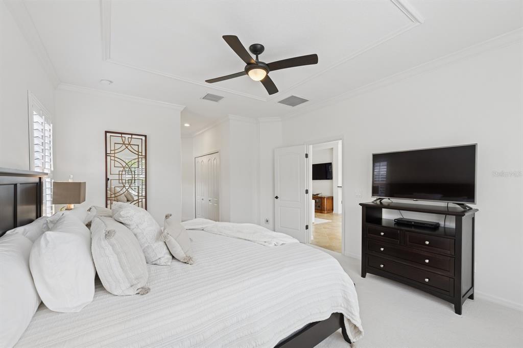 14614 Newtonmore Lane Lakewood Ranch, FL 34202 - Photo 30 of 72 a bedroom with a bed and a flat screen tv