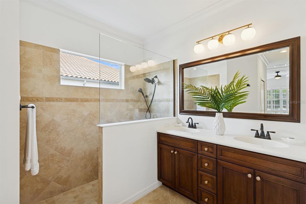 14614 Newtonmore Lane Lakewood Ranch, FL 34202 - Photo 31 of 72 a bathroom with a double vanity sink mirror and