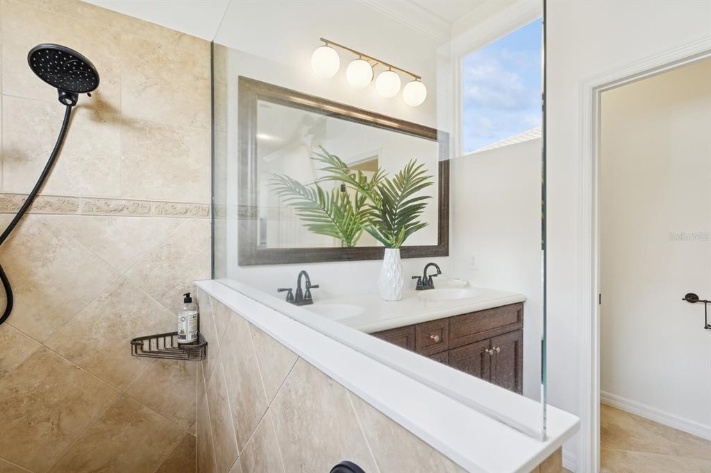 14614 Newtonmore Lane Lakewood Ranch, FL 34202 - Photo 32 of 72 a bathroom with a sink and a mirror