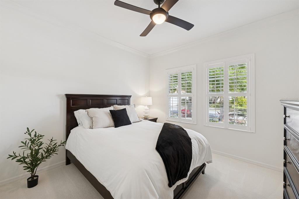 14614 Newtonmore Lane Lakewood Ranch, FL 34202 - Photo 33 of 72 a bedroom with a bed and a window