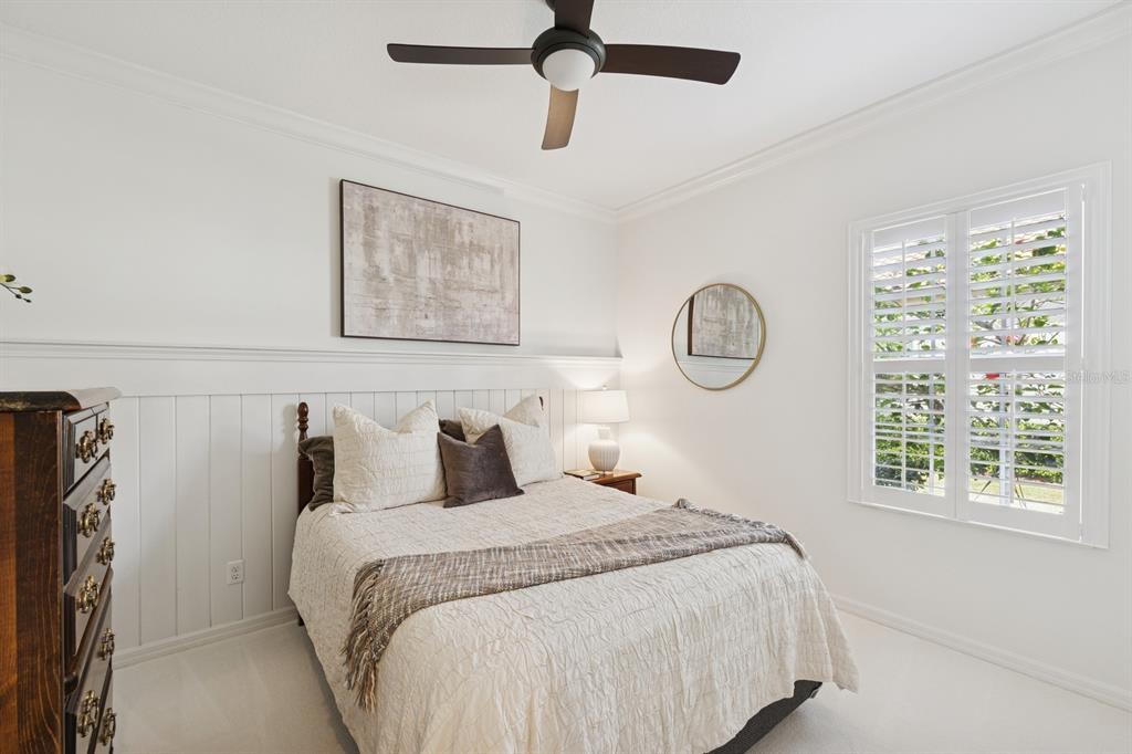 14614 Newtonmore Lane Lakewood Ranch, FL 34202 - Photo 35 of 72 a bedroom with a large bed and a window