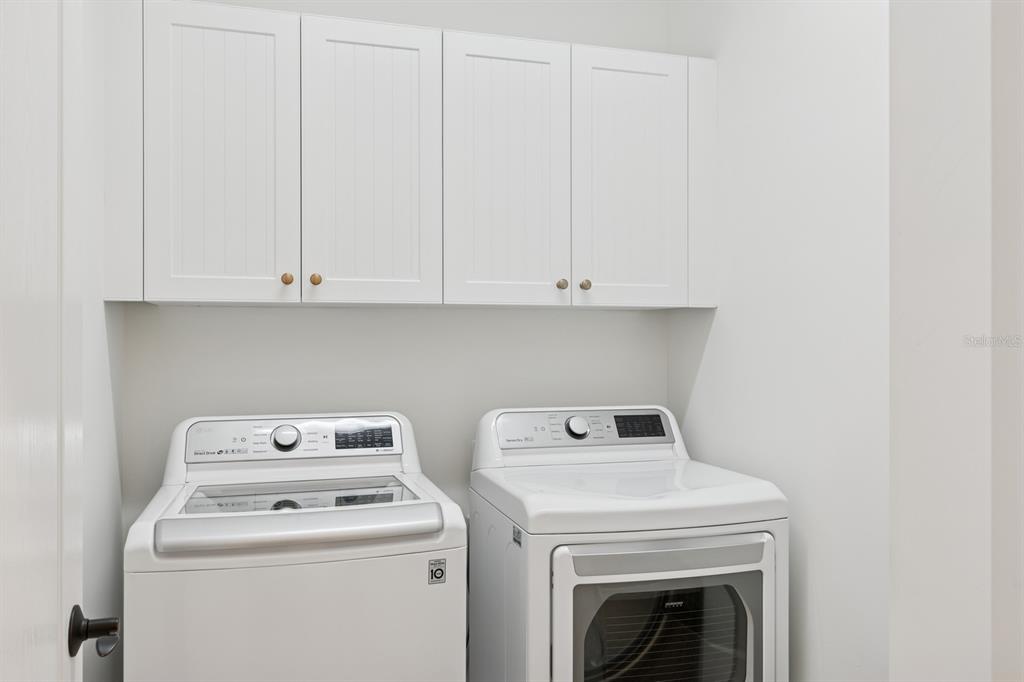 14614 Newtonmore Lane Lakewood Ranch, FL 34202 - Photo 38 of 72 a utility room with dryer and washer