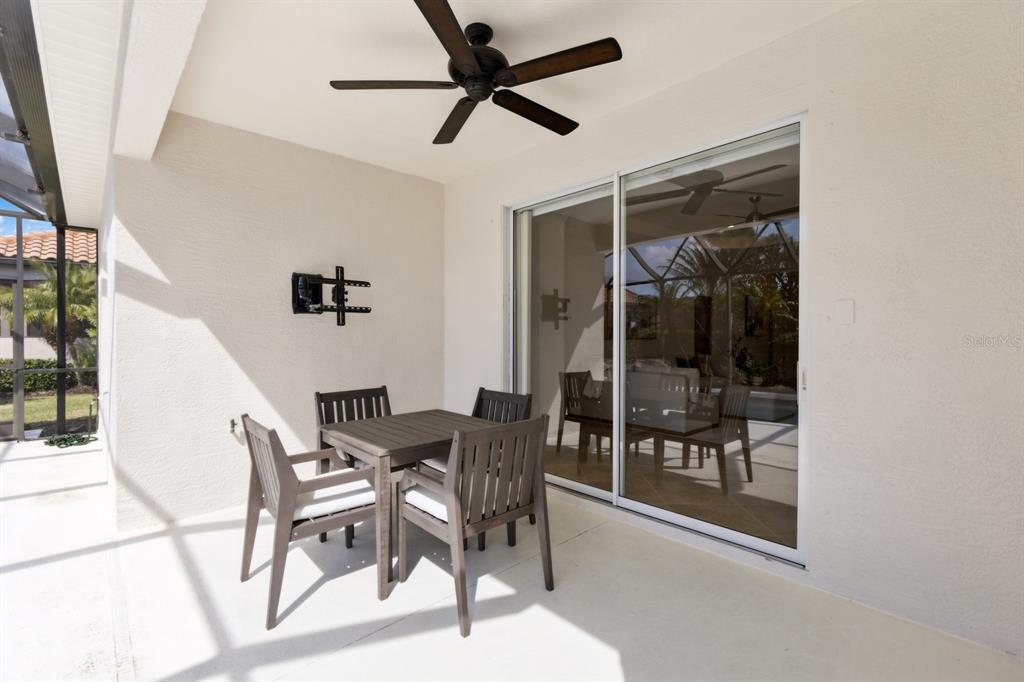 14614 Newtonmore Lane Lakewood Ranch, FL 34202 - Photo 39 of 72 a view of a dining room with furniture and front door