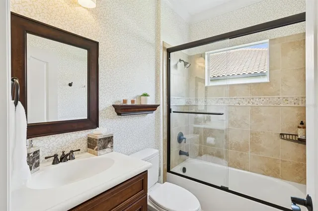 a view of sign board with flower plants