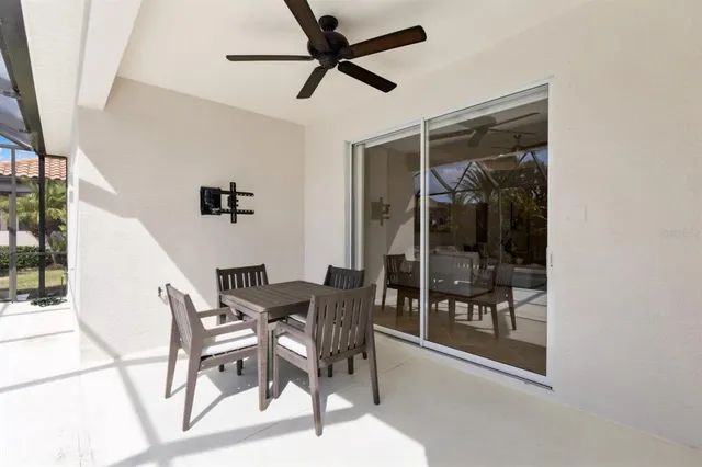 a living room with furniture a wooden floor and chandelier