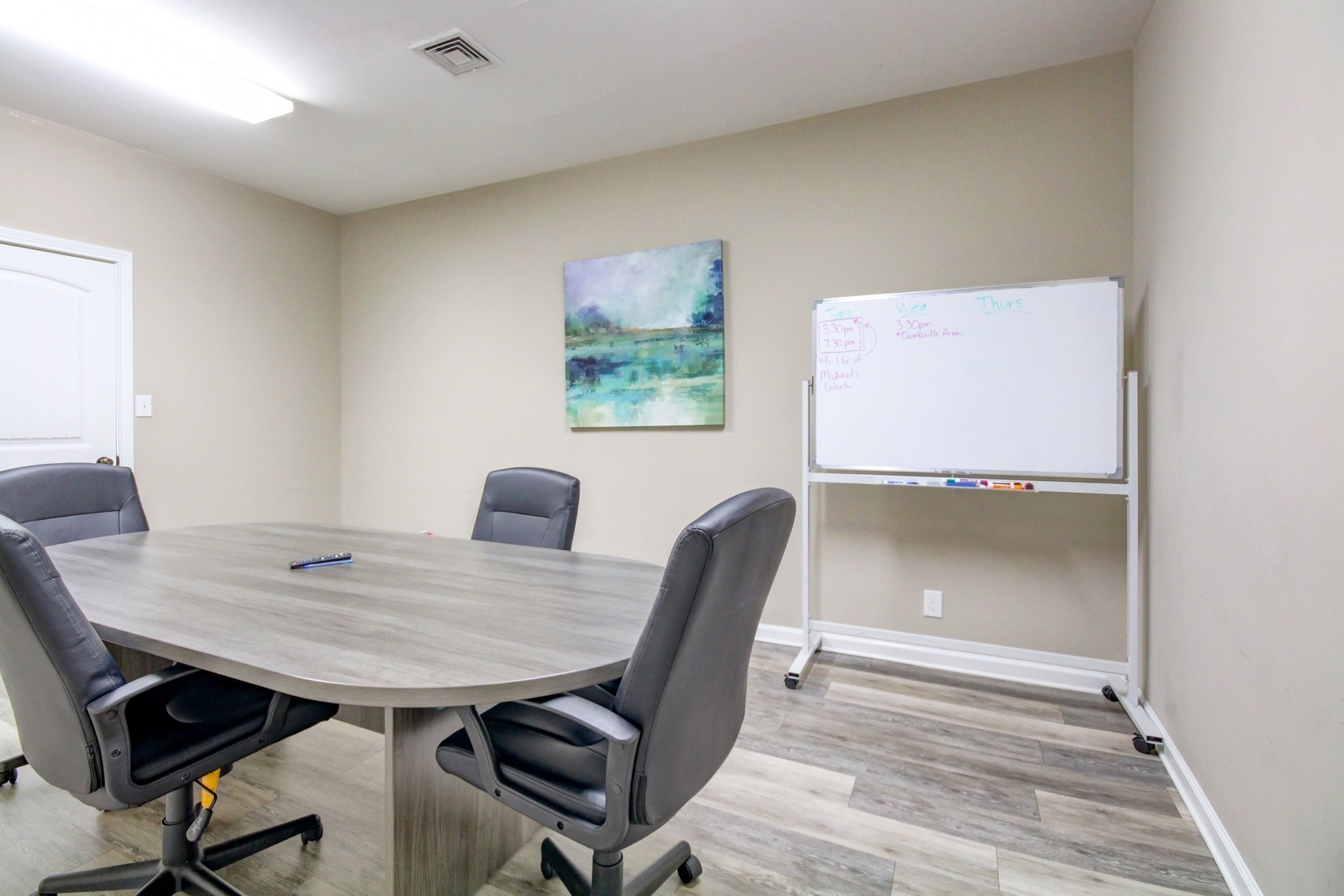 1017 South Riverside Drive Clarksville, TN 37040 - Photo 15 of 51 a view of a workspace with furniture and wooden floor