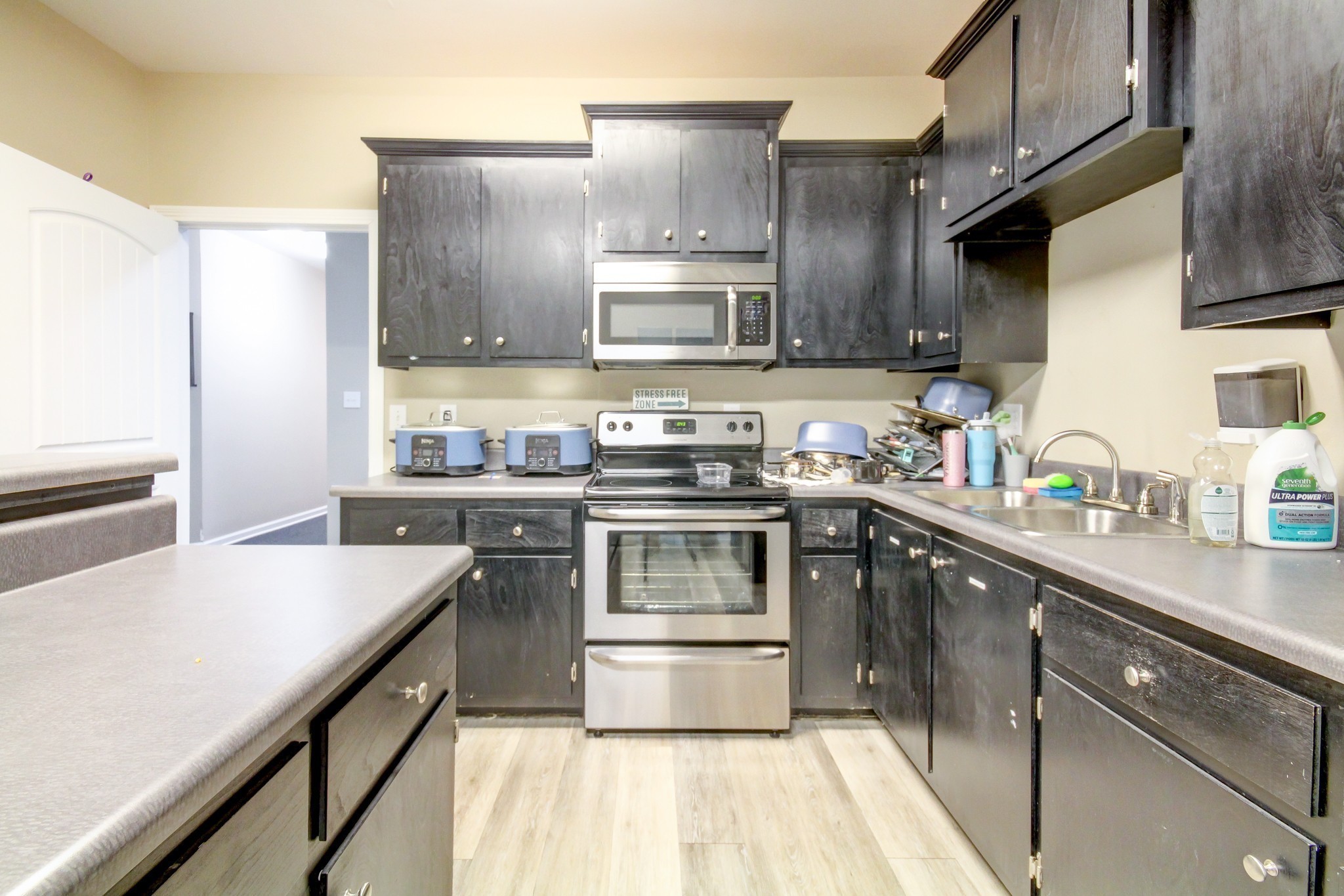 1017 South Riverside Drive Clarksville, TN 37040 - Photo 19 of 51 a kitchen with stainless steel appliances granite countertop a stove a sink and a refrigerator