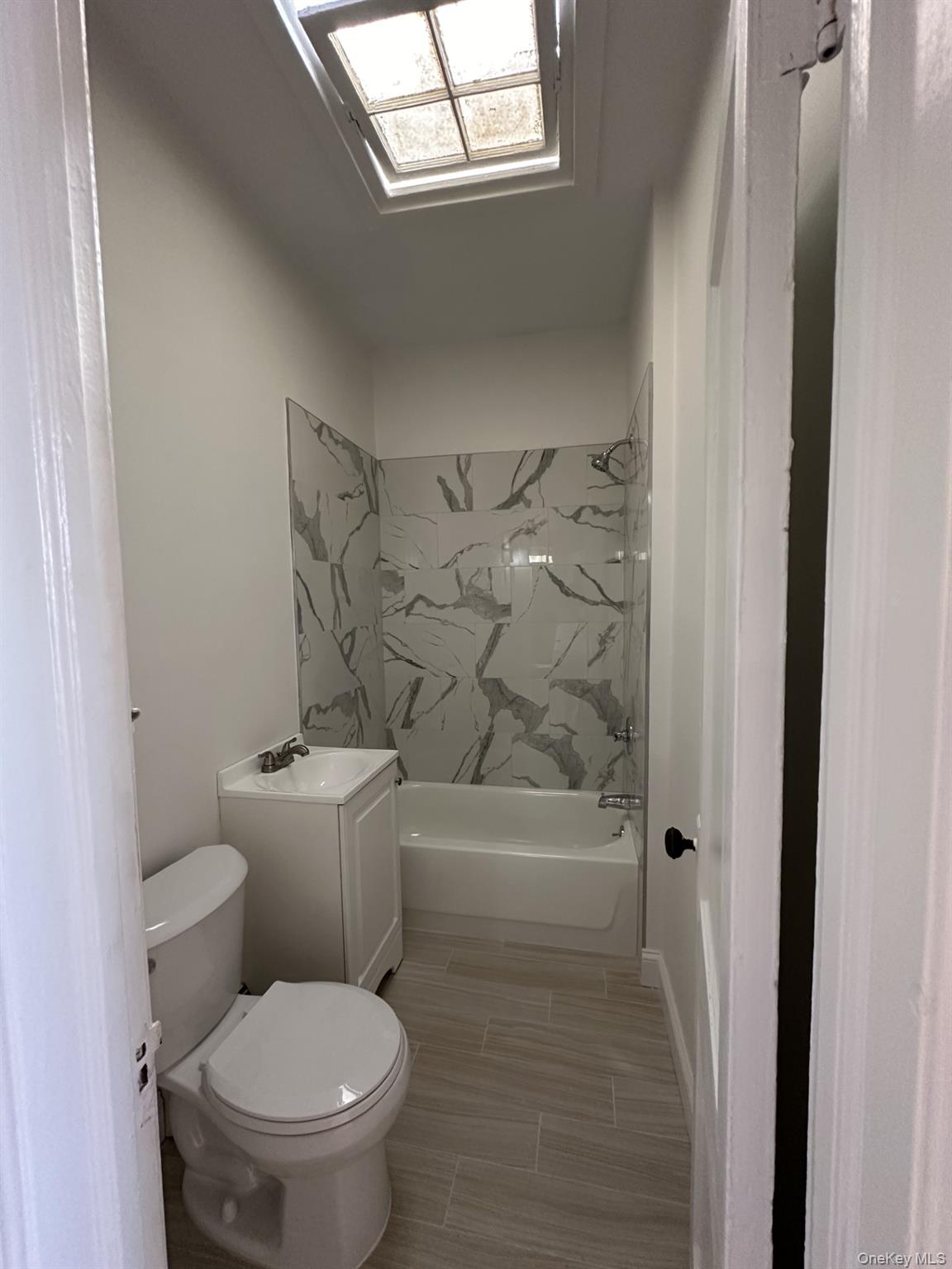 117 Plandome Road, Unit 2R Manhasset, NY 11030 - Photo 12 of 13 Bathroom with vanity and shower / bath combination