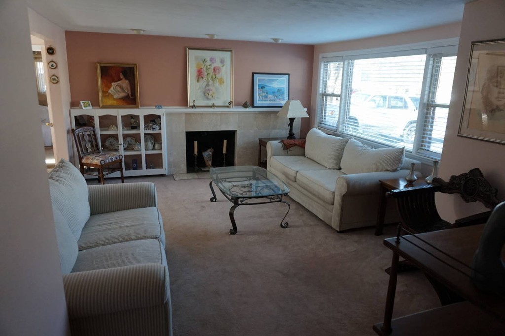 16 Waring Road Natick, MA 01760 - Photo 3 of 12 a living room with furniture and a fireplace