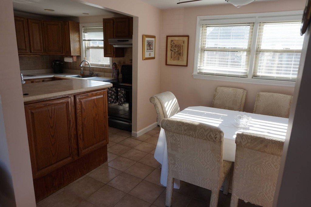 16 Waring Road Natick, MA 01760 - Photo 5 of 12 a bedroom with a bed and furniture