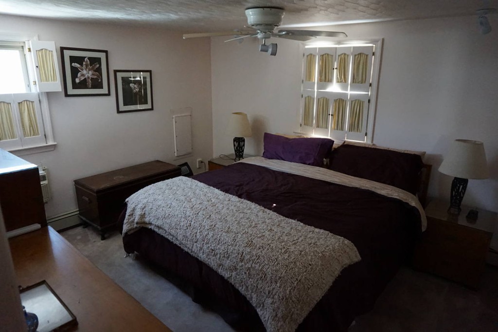 16 Waring Road Natick, MA 01760 - Photo 8 of 12 a bedroom with a large bed and a window