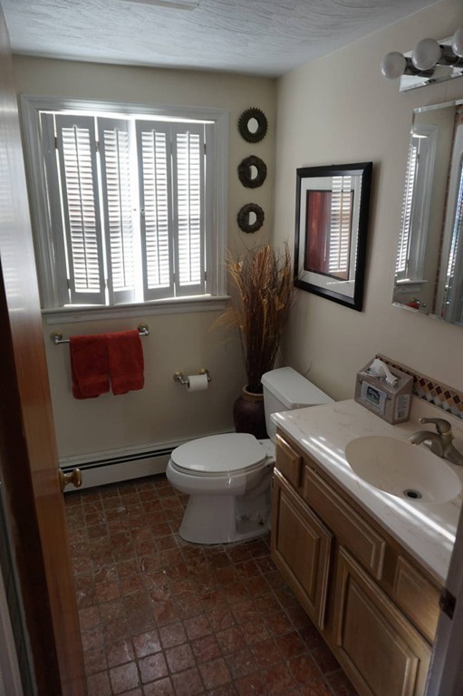 16 Waring Road Natick, MA 01760 - Photo 9 of 12 a bathroom with a sink toilet and window