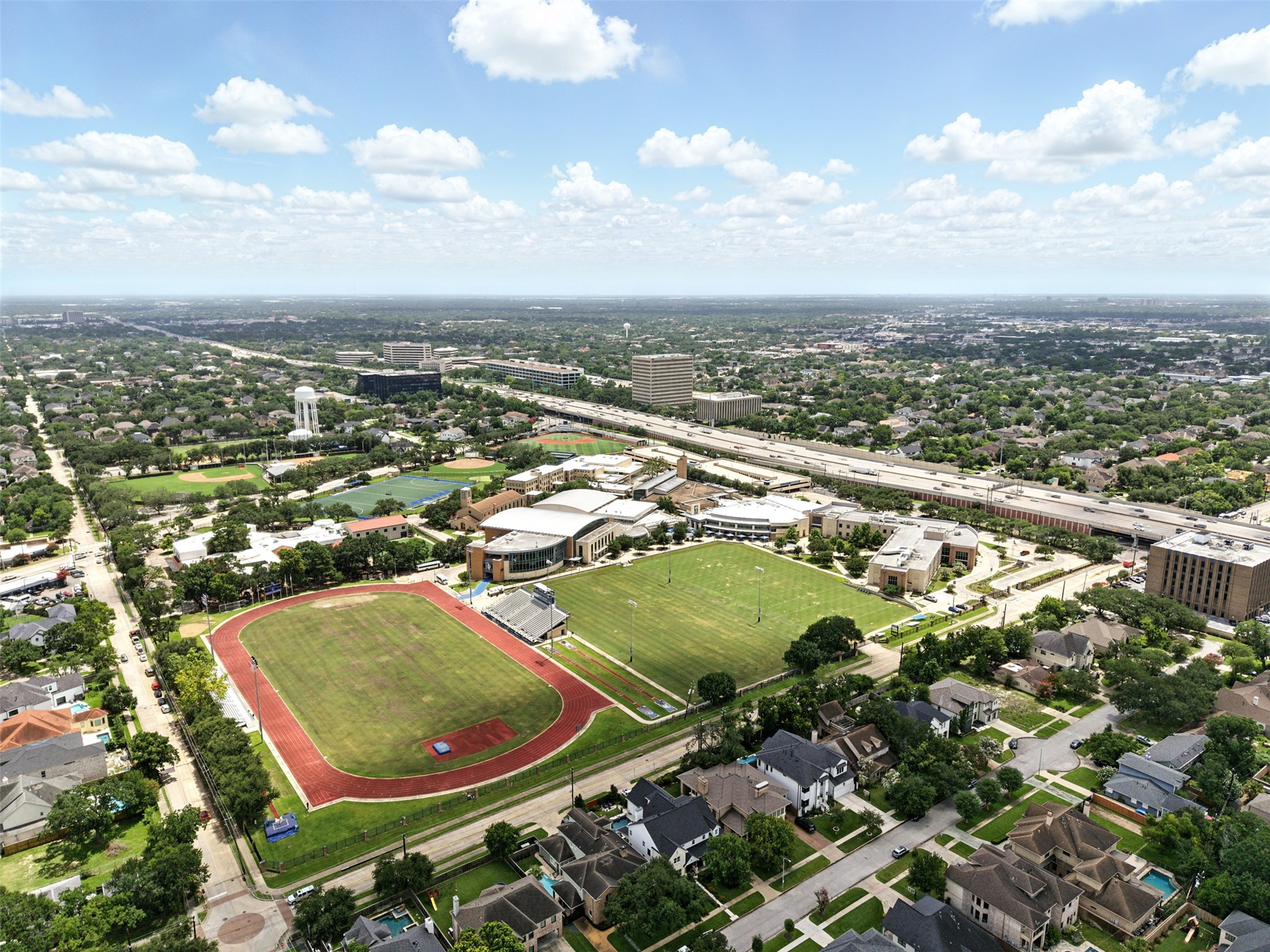 6305 South Rice Avenue Bellaire, TX 77401 - Photo 22 of 23 an aerial view of a residential houses with outdoor space and trees
