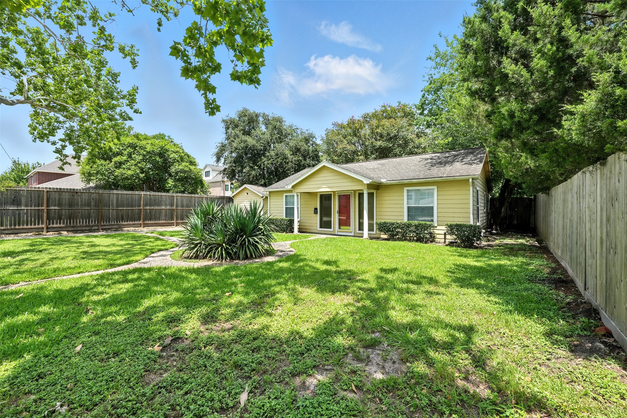 6305 South Rice Avenue Bellaire, TX 77401 - Photo 3 of 23 a view of house with backyard and entertaining space