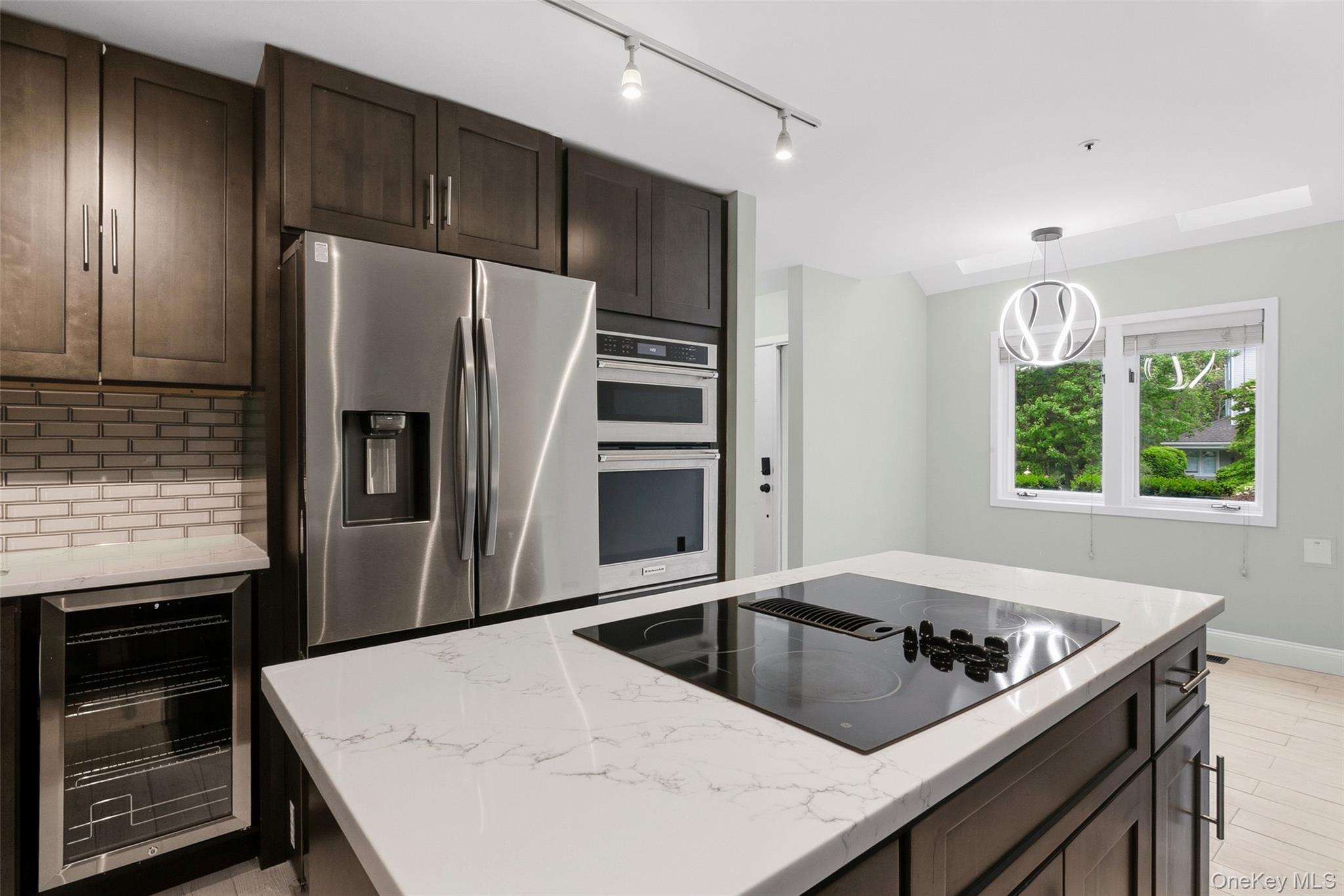 135 Boulder Ridge Road, Unit E87 Scarsdale, NY 10583 - Photo 12 of 47 a kitchen with stainless steel appliances granite countertop a sink stove and refrigerator