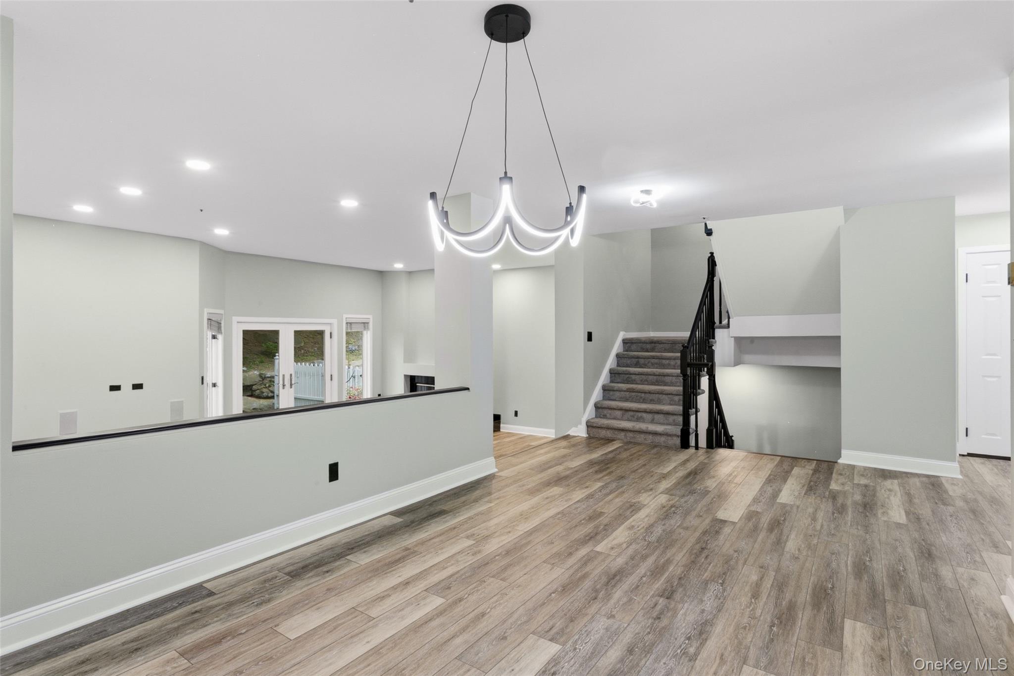 135 Boulder Ridge Road, Unit E87 Scarsdale, NY 10583 - Photo 14 of 47 a view of a livingroom with wooden floor and a ceiling fan