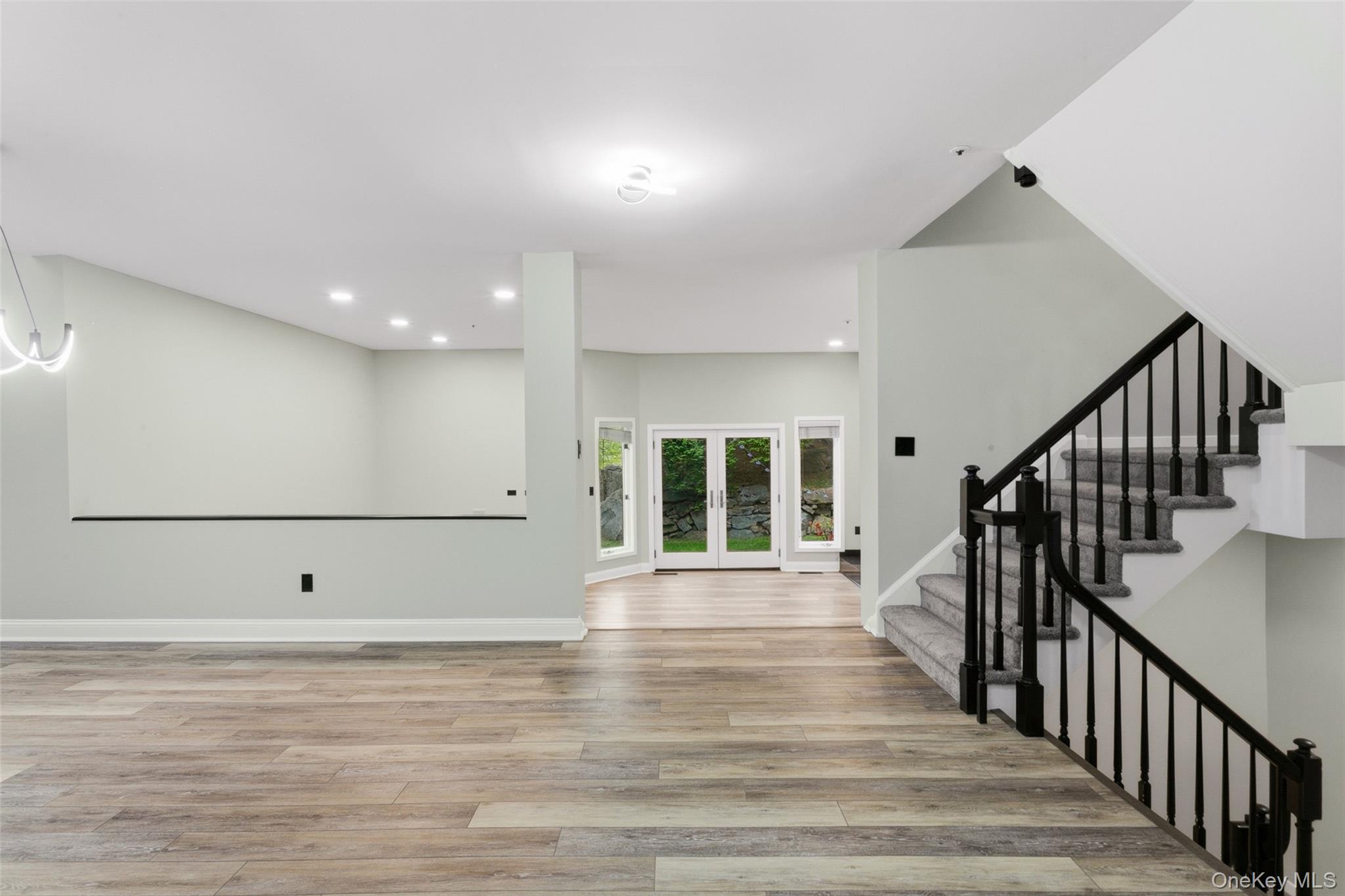 135 Boulder Ridge Road, Unit E87 Scarsdale, NY 10583 - Photo 17 of 47 a view of a room with wooden floor and stairs