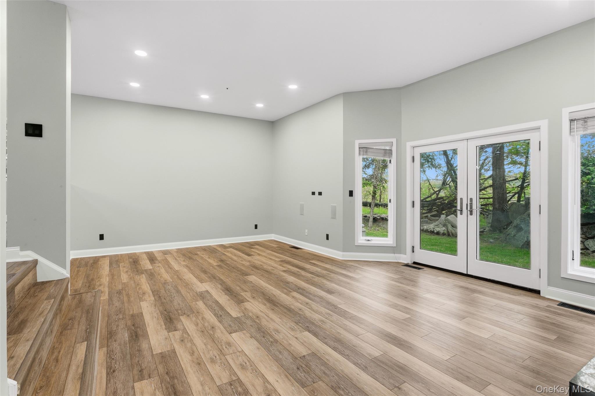 135 Boulder Ridge Road, Unit E87 Scarsdale, NY 10583 - Photo 19 of 47 a view of an empty room with wooden floor and a window