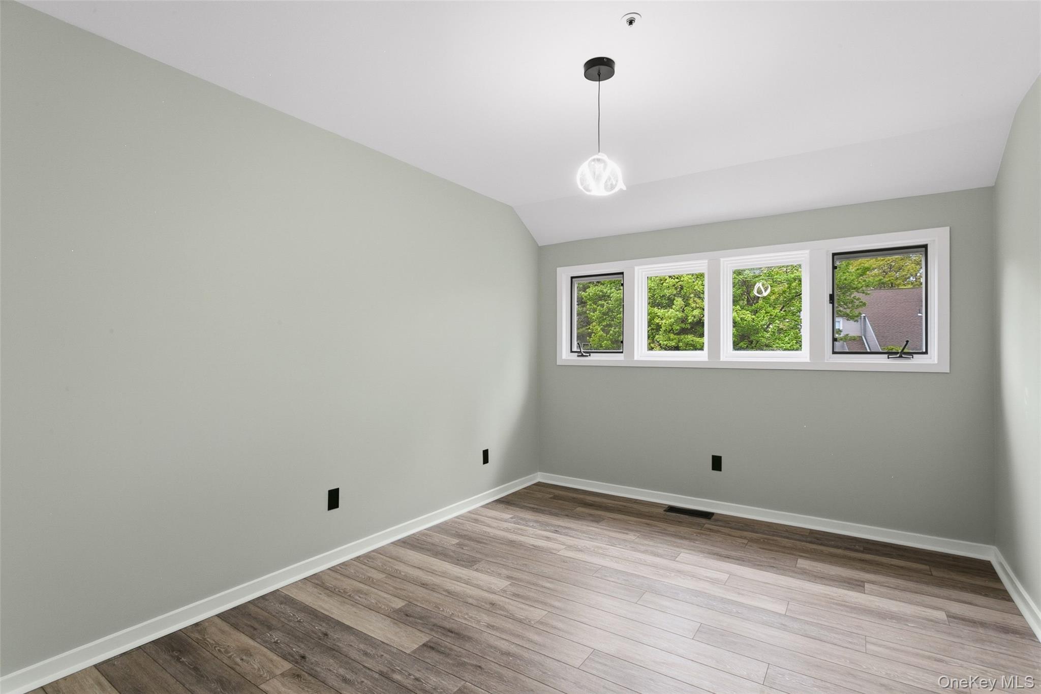 135 Boulder Ridge Road, Unit E87 Scarsdale, NY 10583 - Photo 22 of 47 a view of room with window and hardwood floor