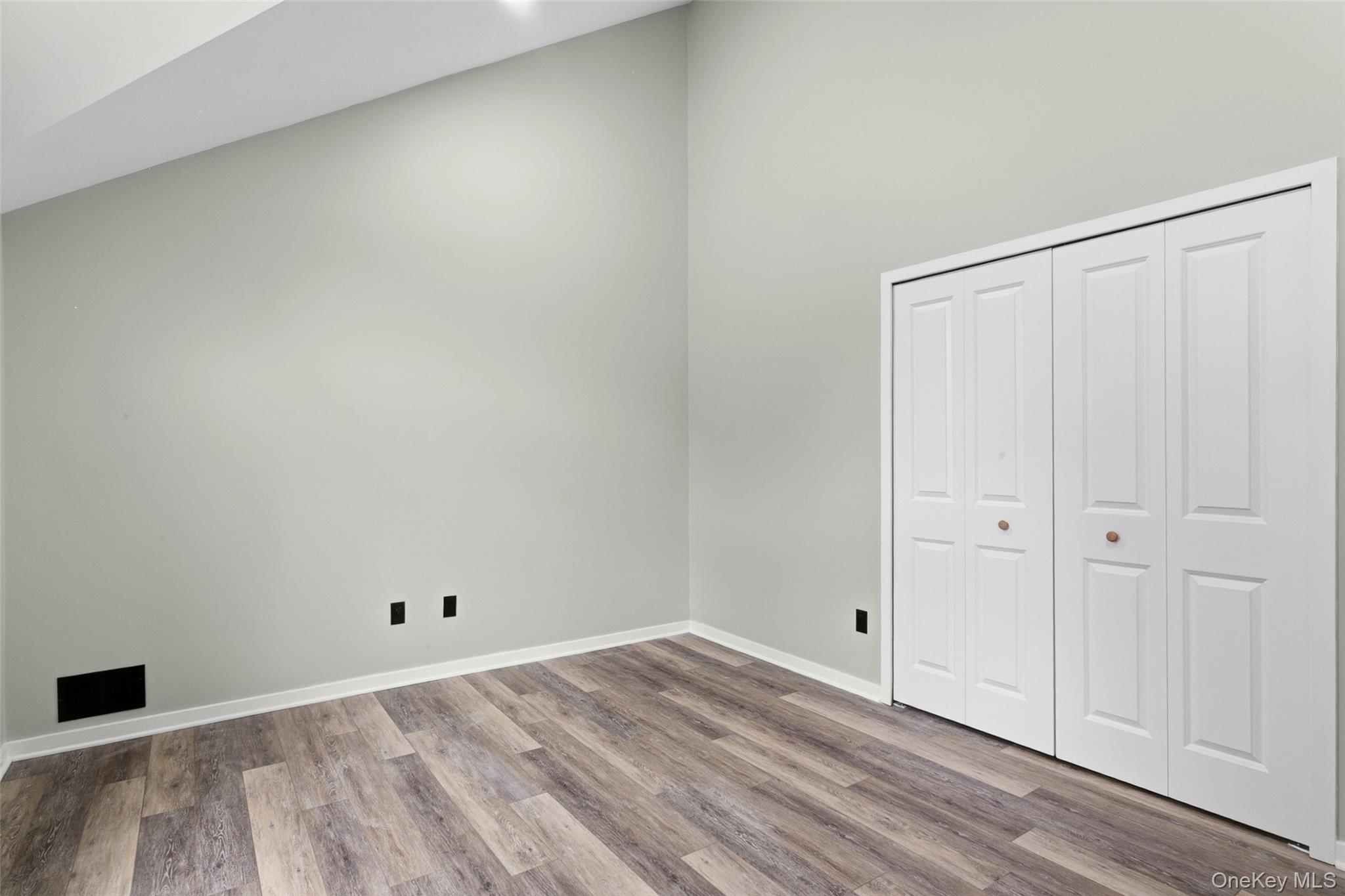 135 Boulder Ridge Road, Unit E87 Scarsdale, NY 10583 - Photo 28 of 47 a view of a room with wooden floor and closet