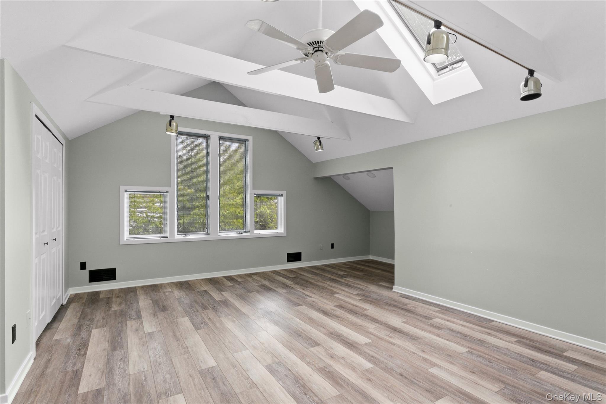 135 Boulder Ridge Road, Unit E87 Scarsdale, NY 10583 - Photo 32 of 47 an empty room with windows and fan