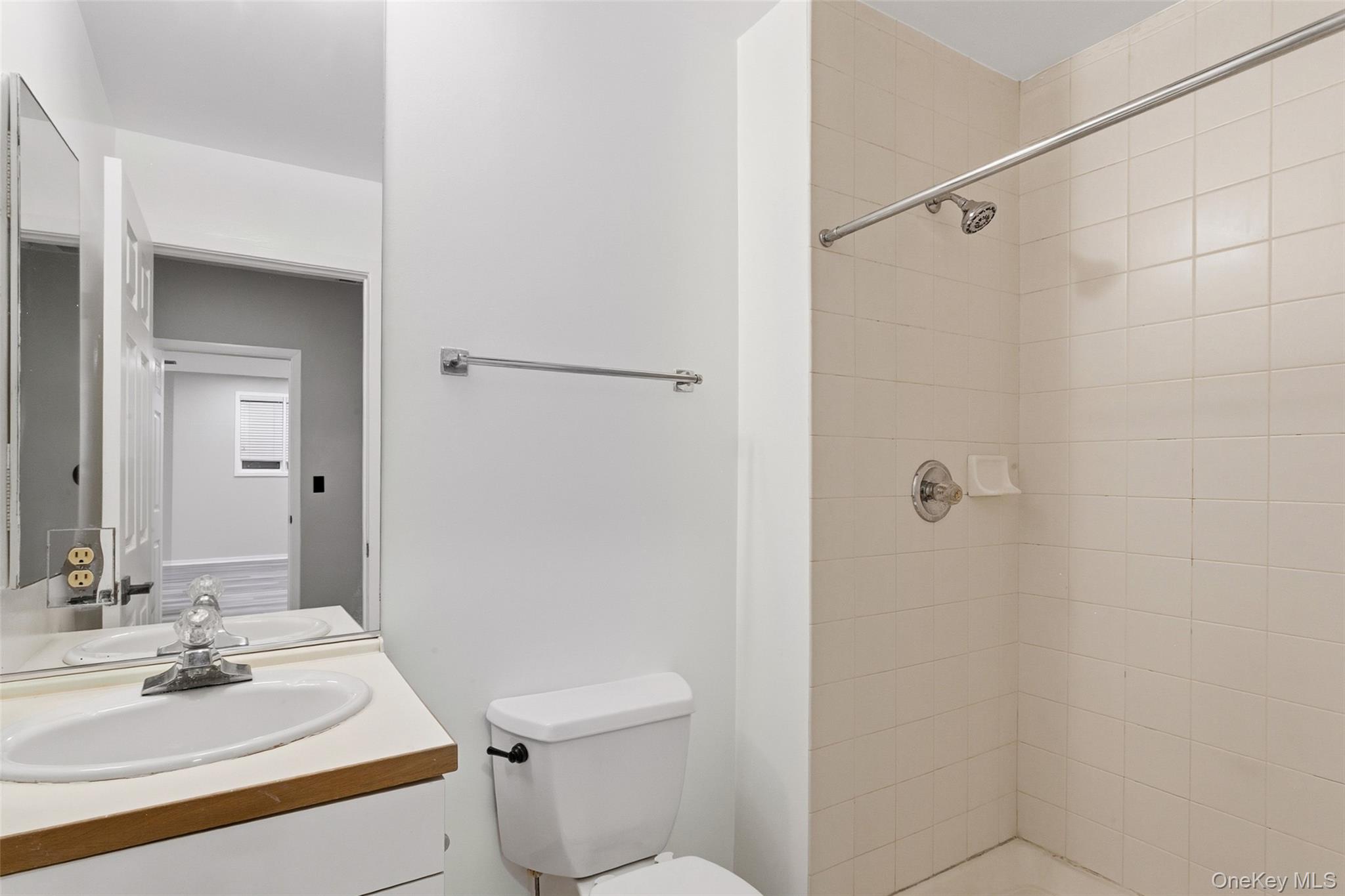 135 Boulder Ridge Road, Unit E87 Scarsdale, NY 10583 - Photo 35 of 47 a bathroom with a sink toilet and shower