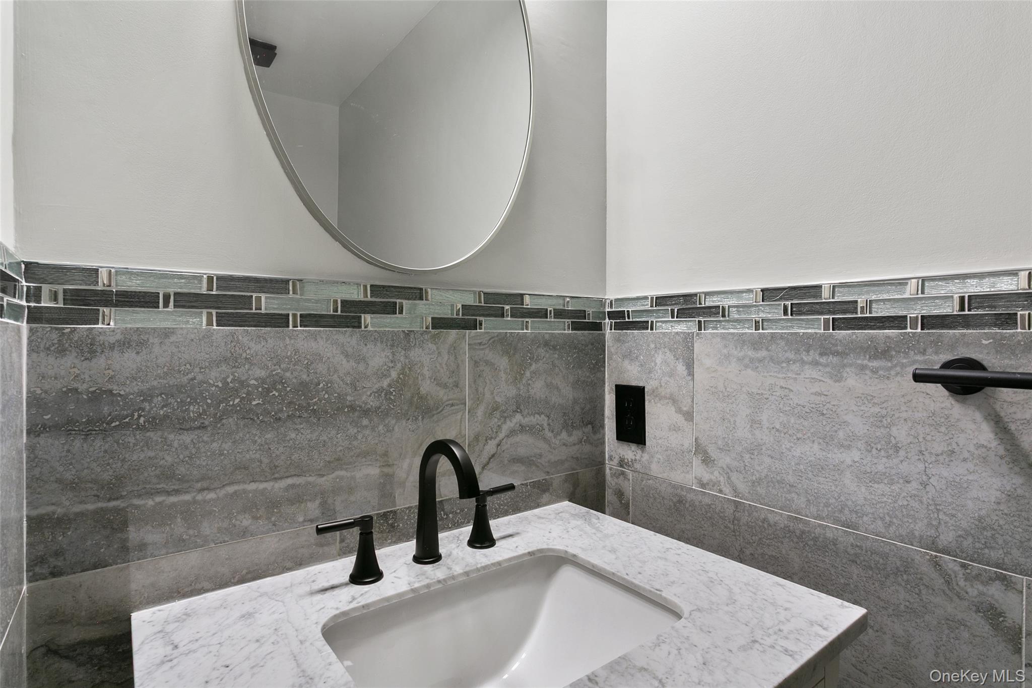 135 Boulder Ridge Road, Unit E87 Scarsdale, NY 10583 - Photo 39 of 47 a bathroom with a sink a mirror and shower