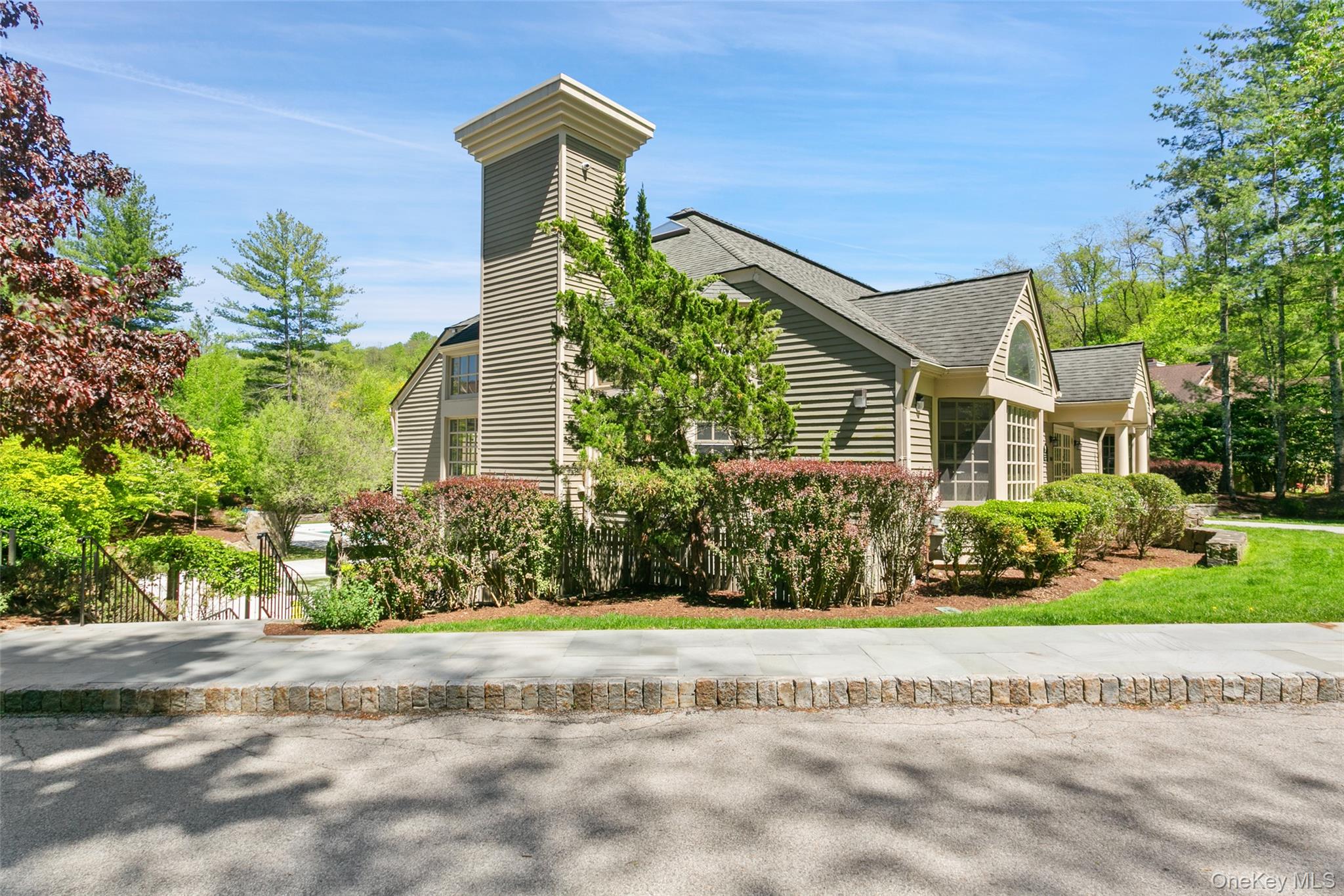 135 Boulder Ridge Road, Unit E87 Scarsdale, NY 10583 - Photo 42 of 47 a front view of a house with a yard