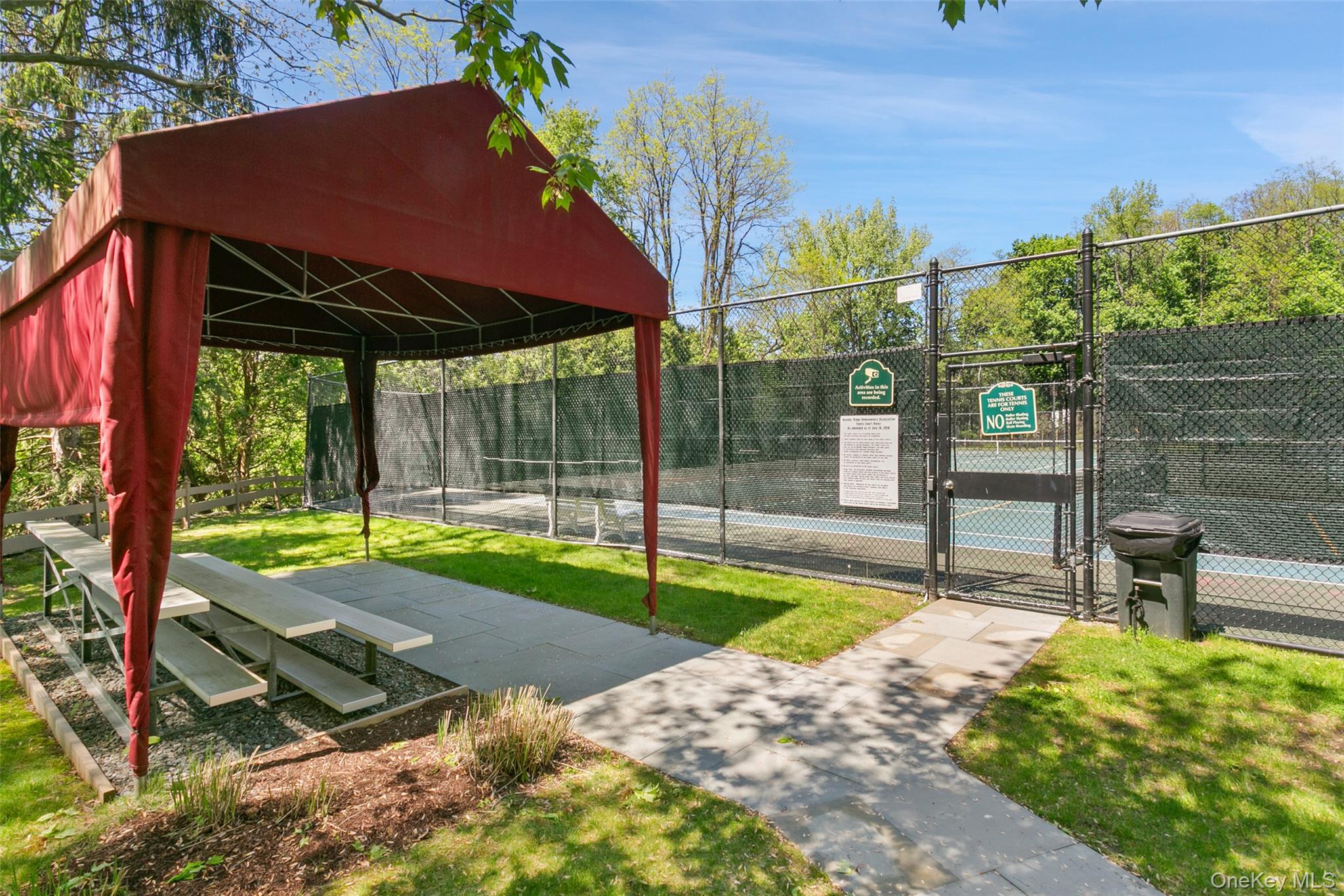 135 Boulder Ridge Road, Unit E87 Scarsdale, NY 10583 - Photo 47 of 47 a view of a backyard with a garden and plants