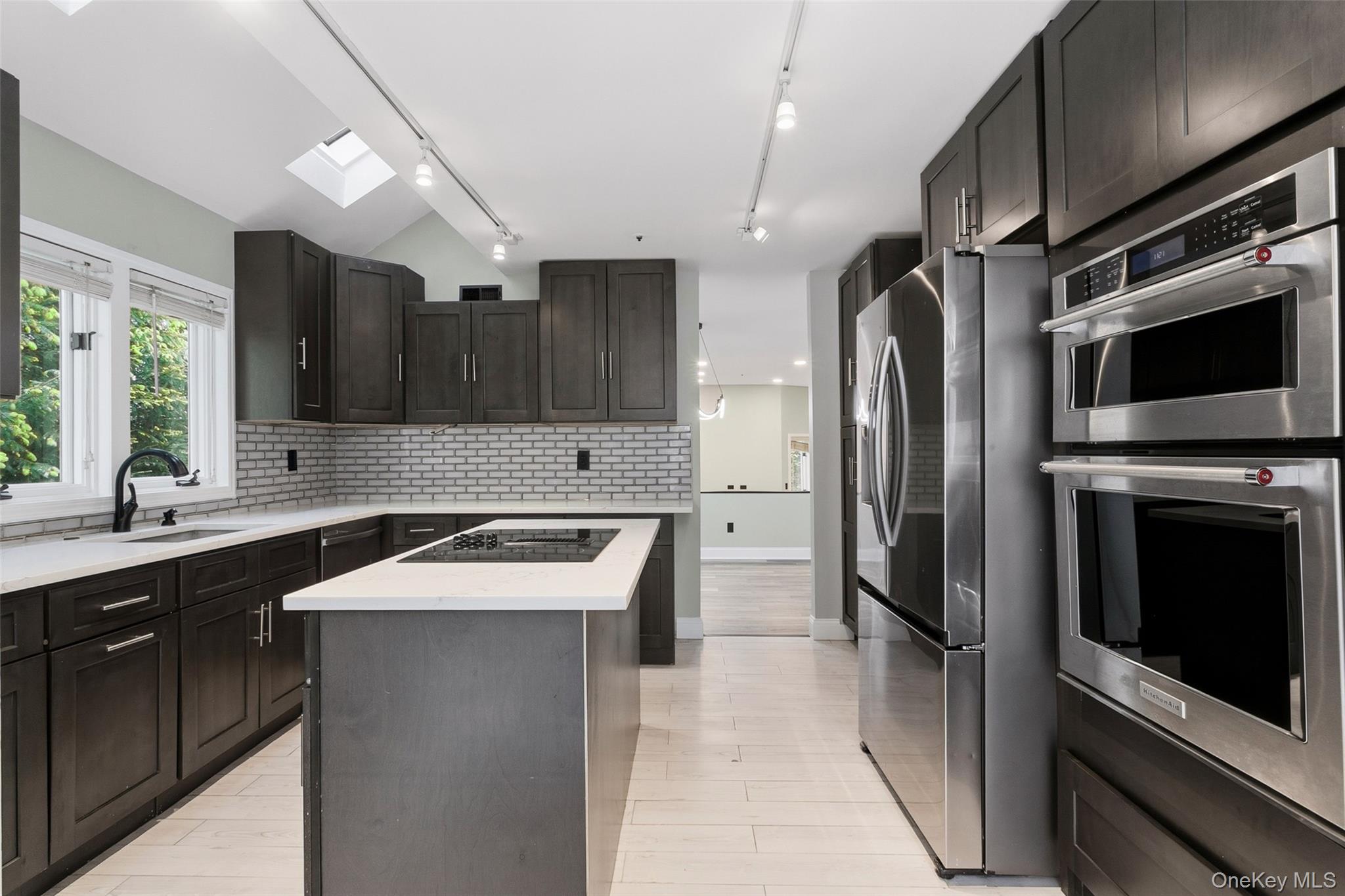 135 Boulder Ridge Road, Unit E87 Scarsdale, NY 10583 - Photo 8 of 47 a kitchen with a sink stainless steel appliances and cabinets