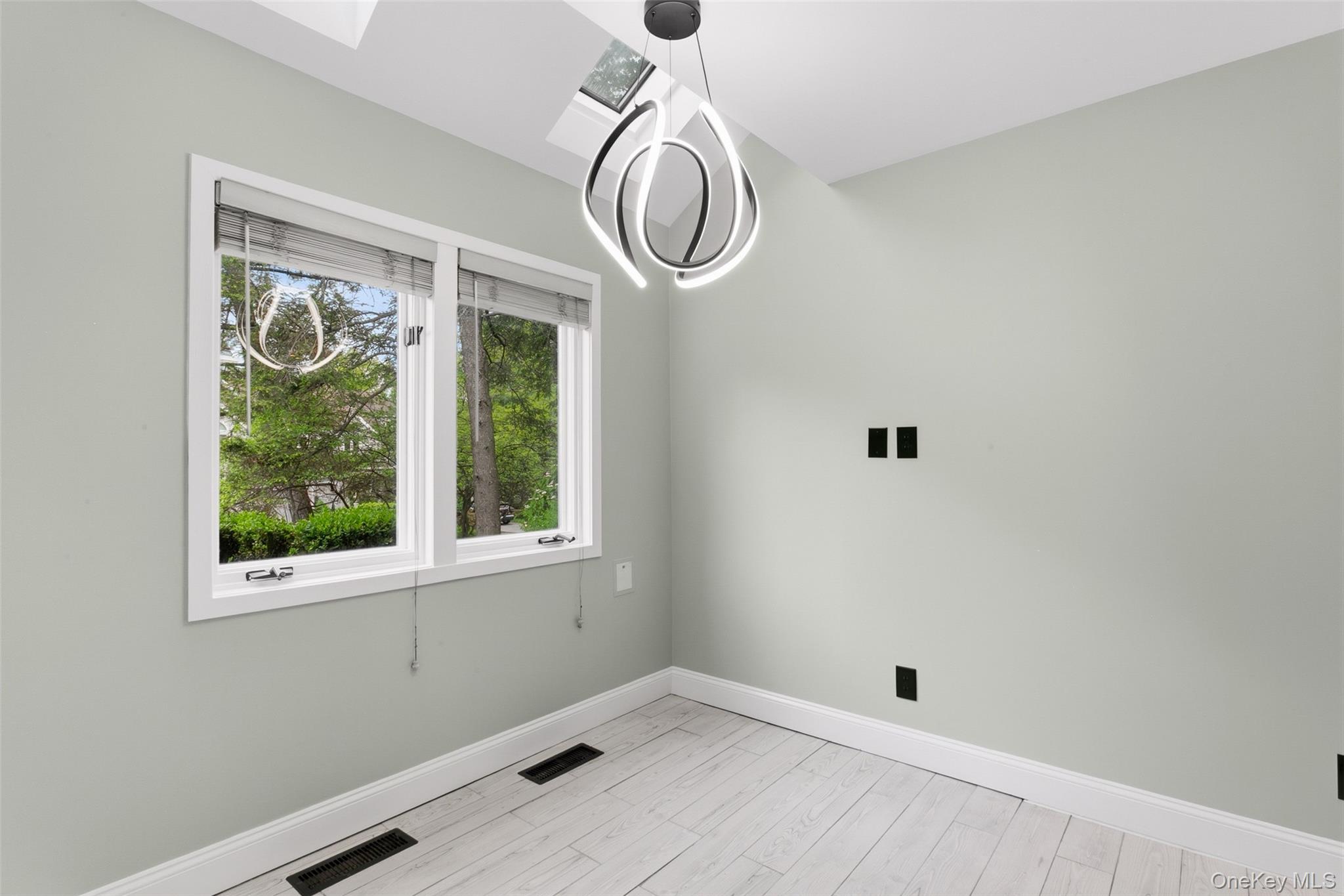 135 Boulder Ridge Road, Unit E87 Scarsdale, NY 10583 - Photo 10 of 47 a view of room with window and hardwood floor