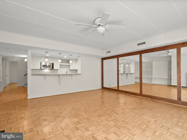 a view of an empty room with a window