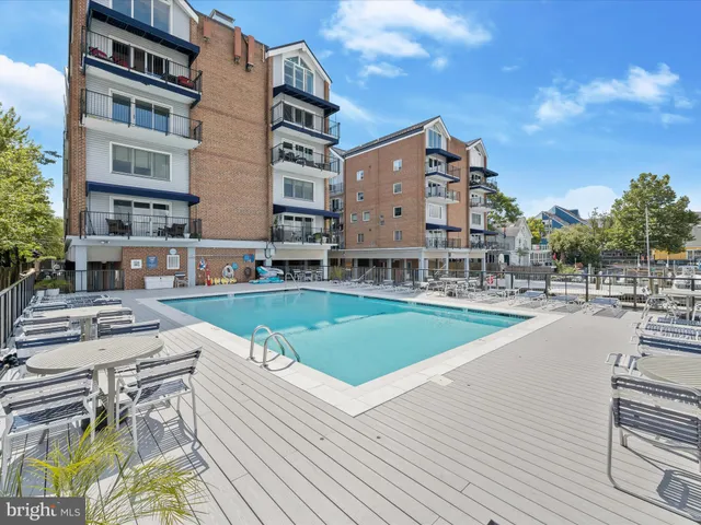 a view of a swimming pool with a lounge chairs