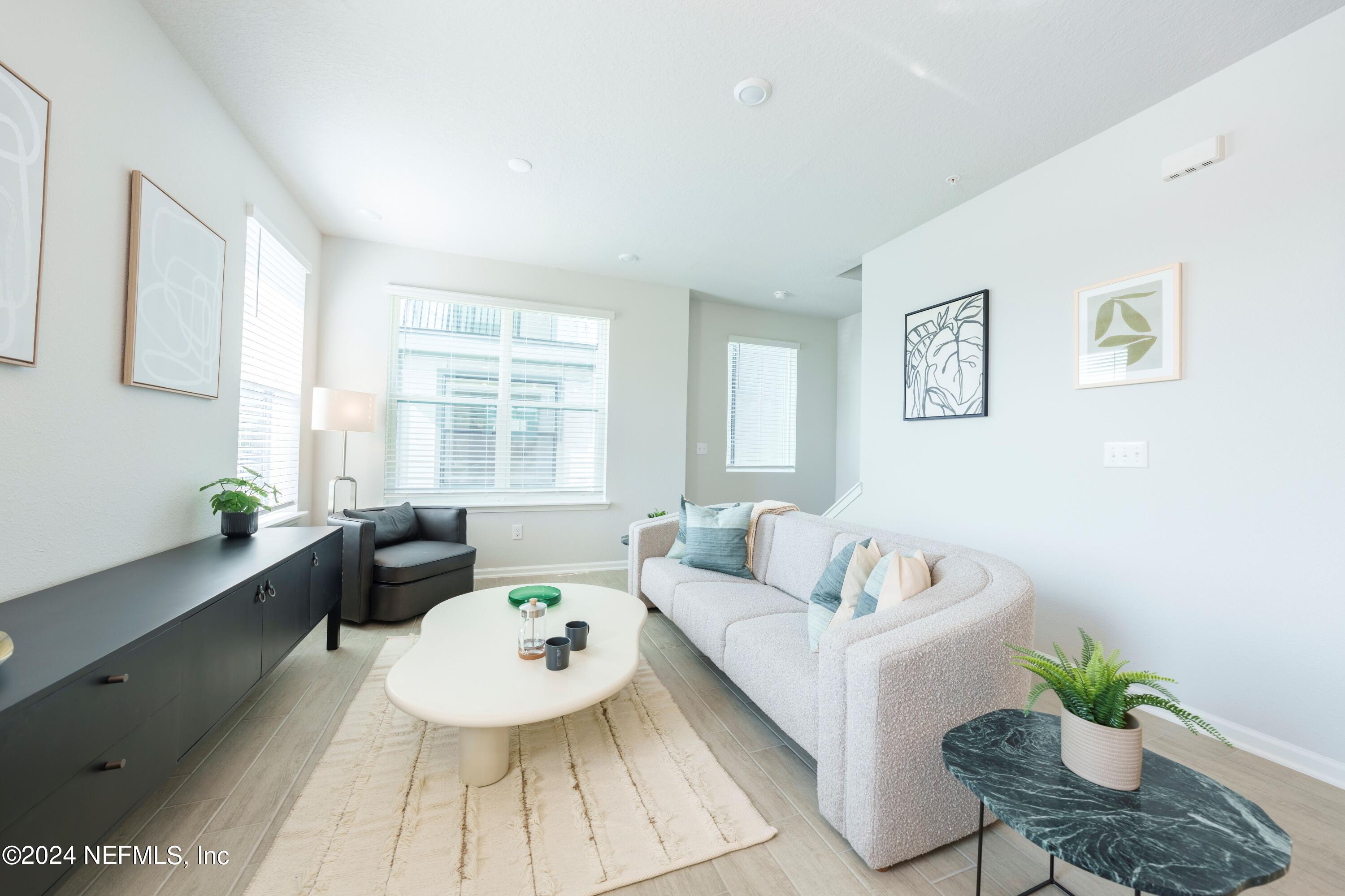 161 Barstow Place Jacksonville, FL 32204 - Photo 22 of 39 a living room with furniture and a large window