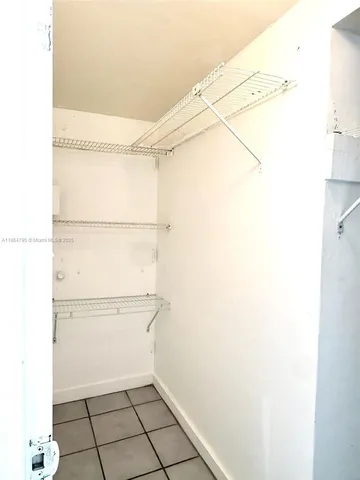 a view of a room with racks on the wall