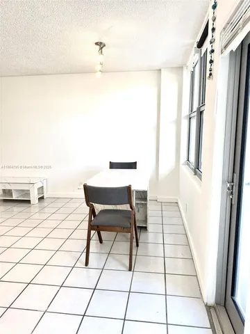 a view of a bathroom with a sink and a mirror