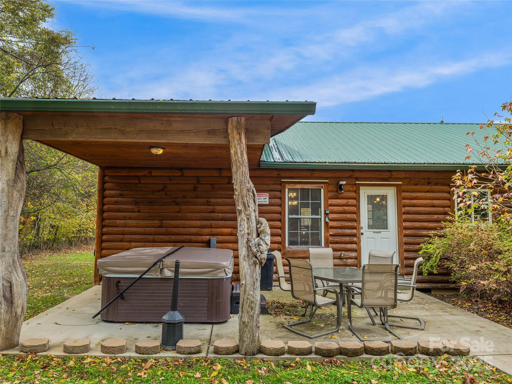 1640-1641 River Road Hot Springs, NC 28743 - Photo 29 of 48 a front view of a house with garden