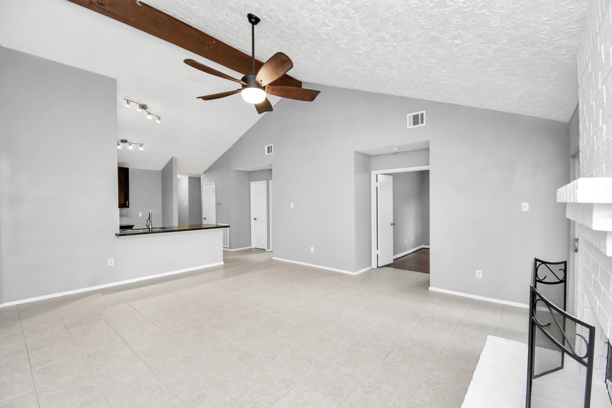 10219 Trading Post Drive Houston, TX 77064 - Photo 12 of 39 a view of an empty room with window and a kitchen