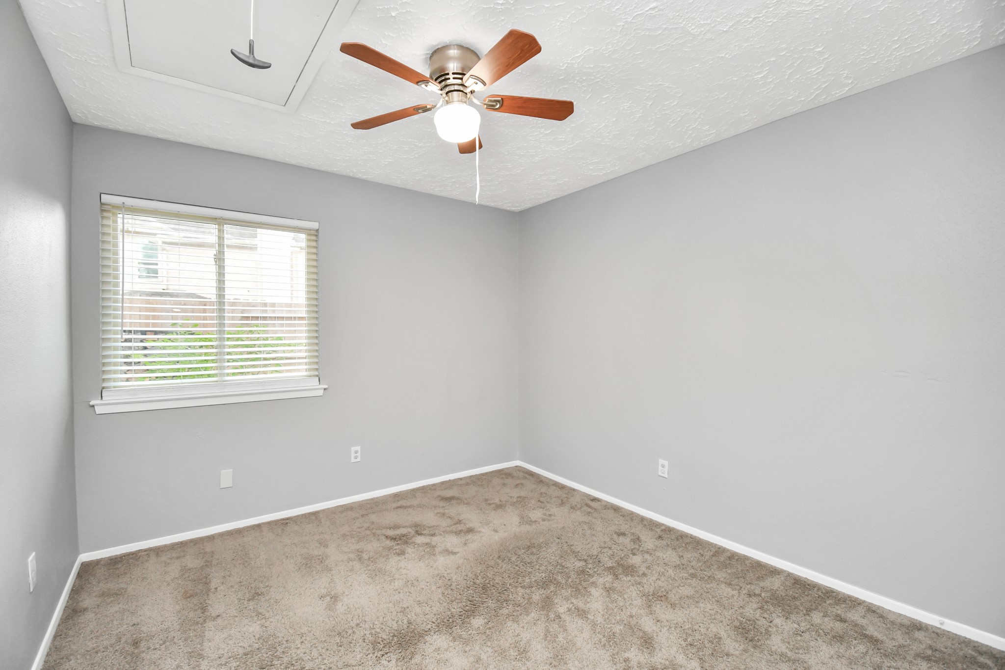 10219 Trading Post Drive Houston, TX 77064 - Photo 30 of 39 an empty room with a window and a ceiling fan