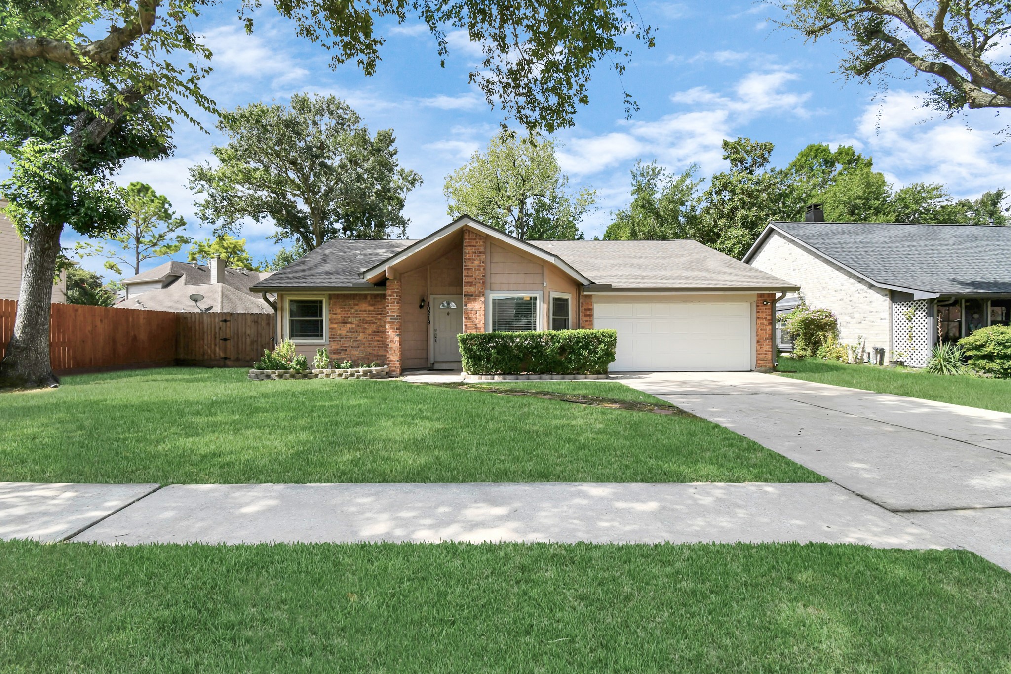 10219 Trading Post Drive Houston, TX 77064 - Photo 39 of 39 a view of a yard in front of a house with plants and large tree