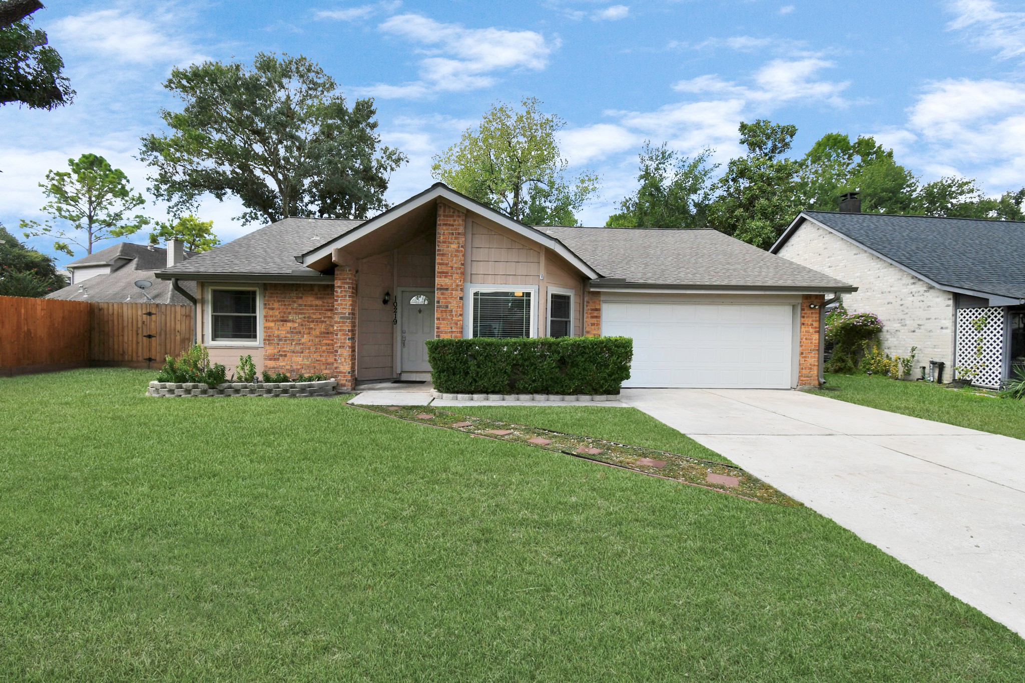 10219 Trading Post Drive Houston, TX 77064 - Photo 5 of 39 a front view of house with yard and green space