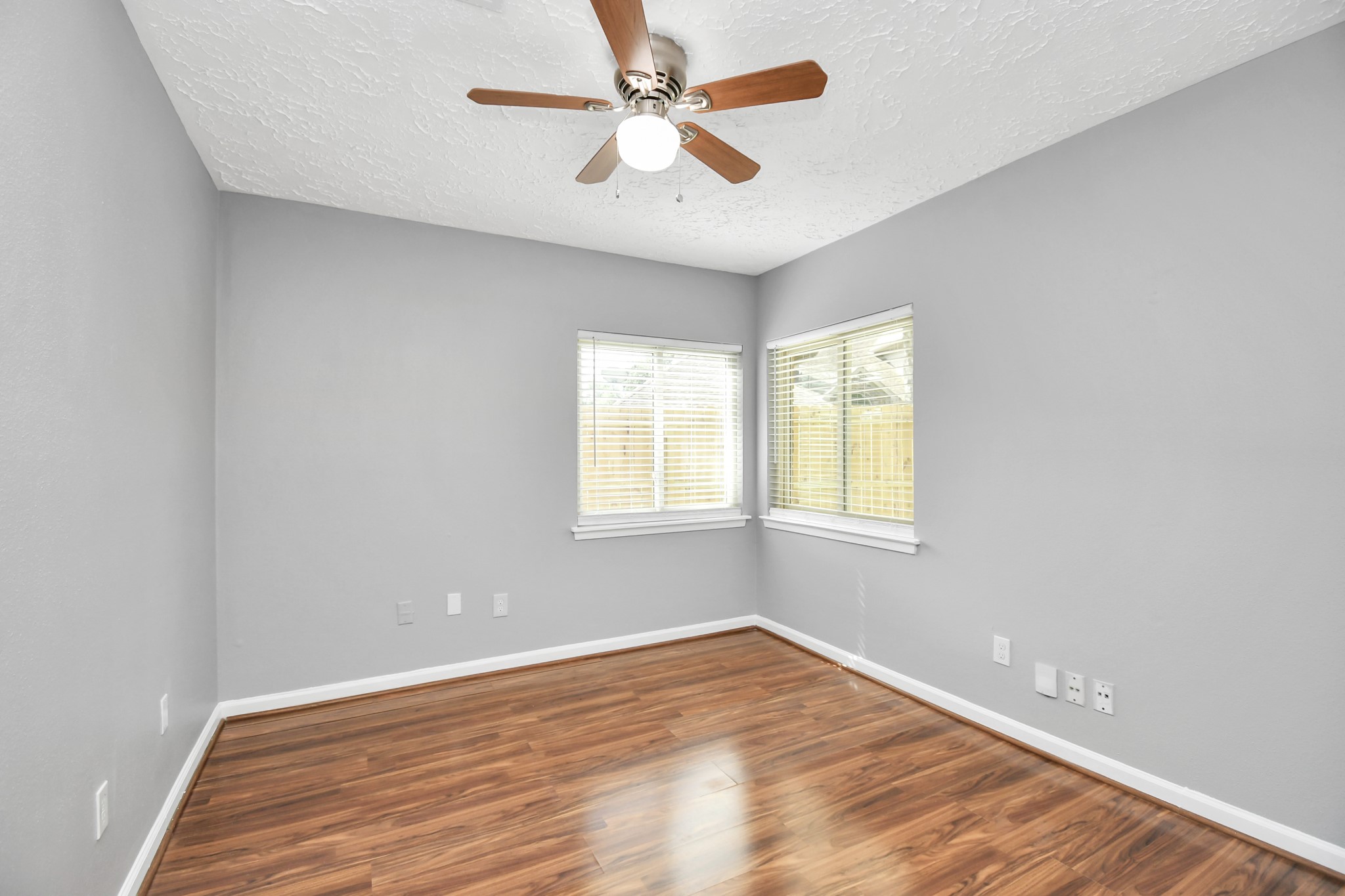 10219 Trading Post Drive Houston, TX 77064 - Photo 7 of 39 wooden floor in an empty room with a window