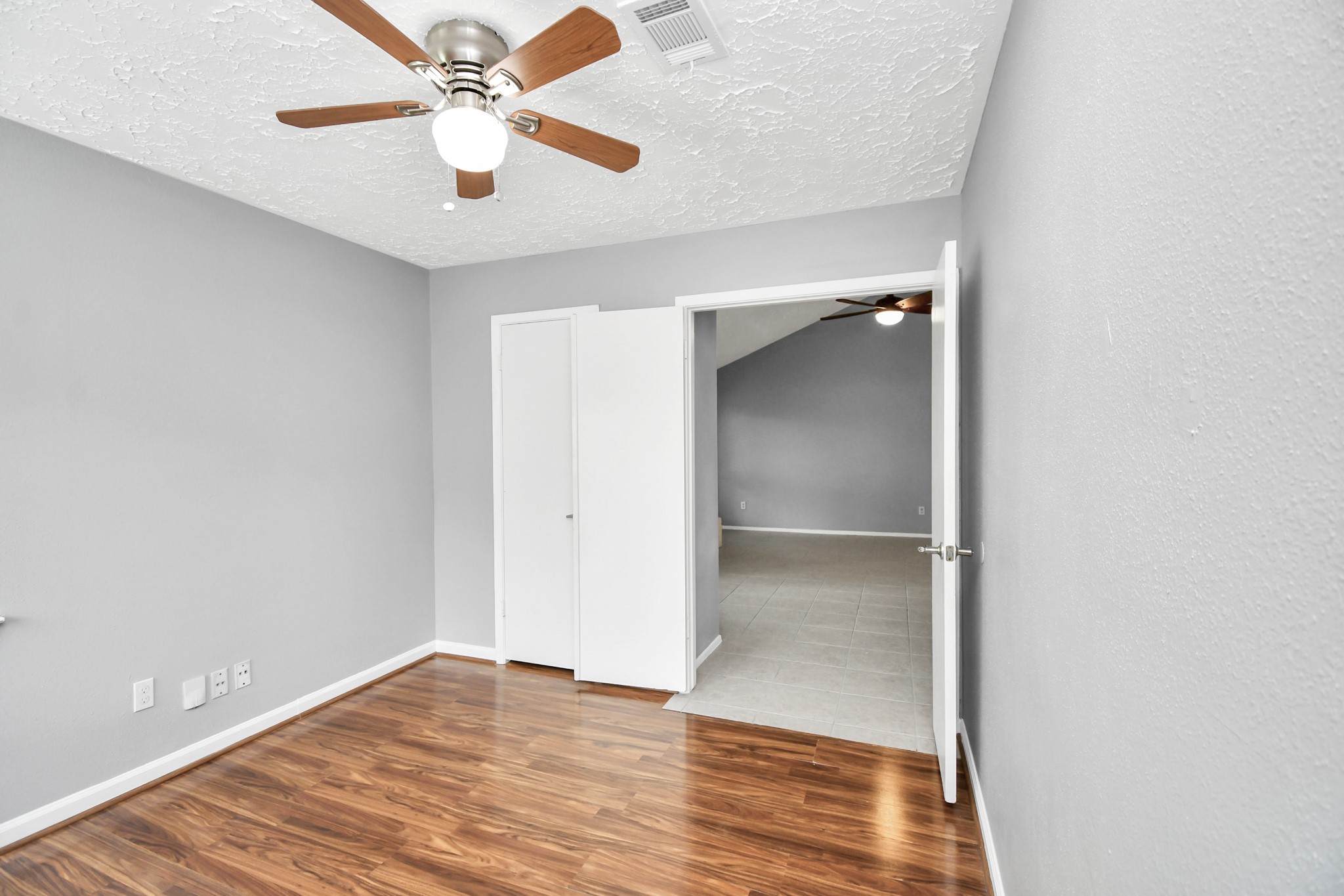10219 Trading Post Drive Houston, TX 77064 - Photo 8 of 39 a view of an empty room with wooden floor