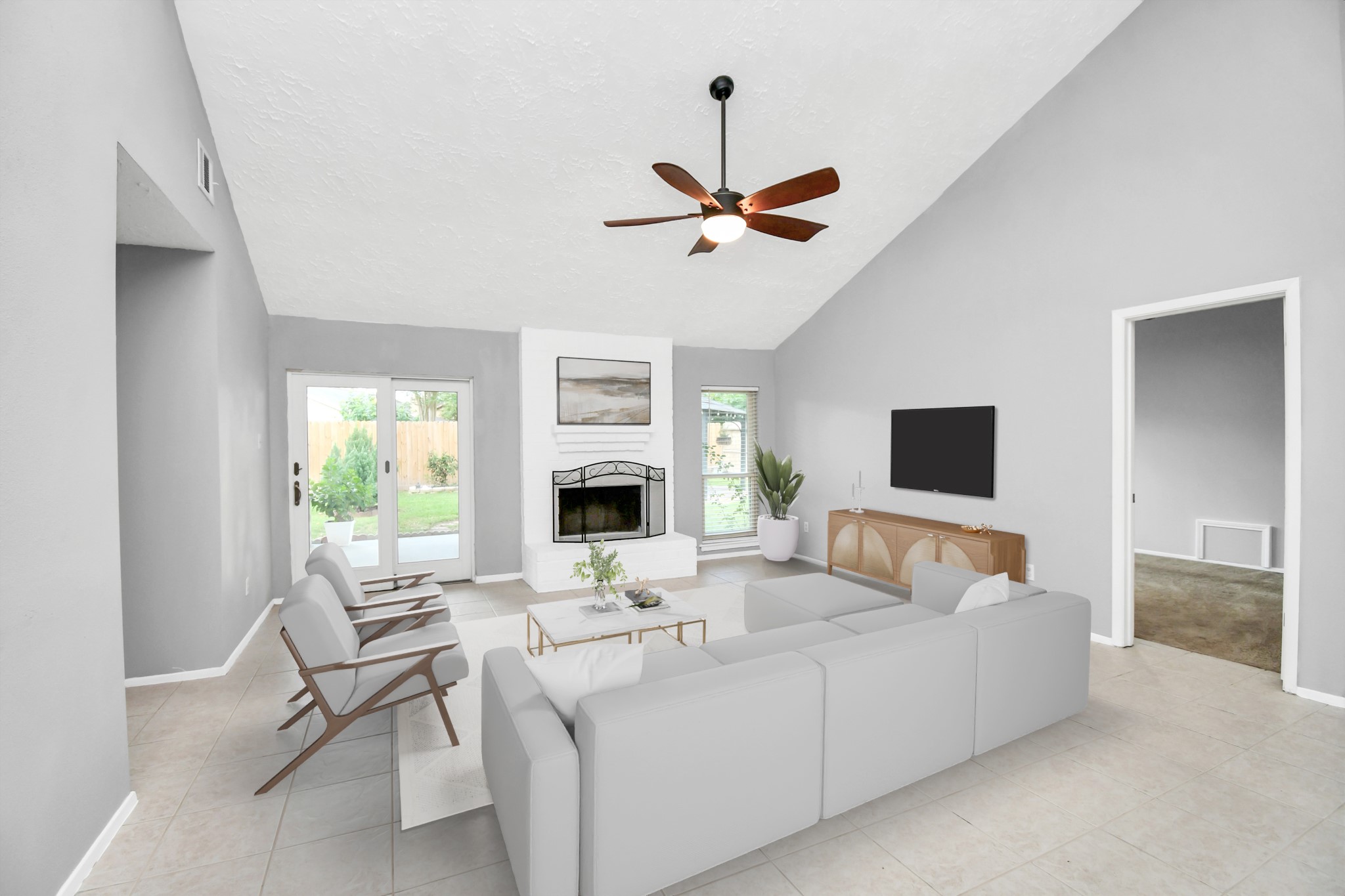 10219 Trading Post Drive Houston, TX 77064 - Photo 10 of 39 a living room with furniture a fireplace and a flat screen tv