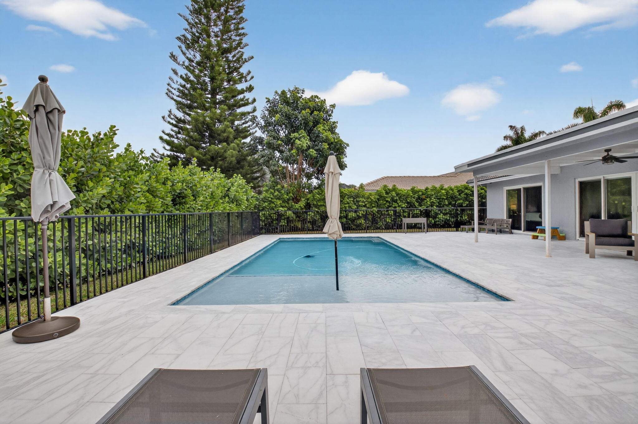 10302 Crosswind Road Boca Raton, FL 33498 - Photo 13 of 27 a view of a patio with a yard