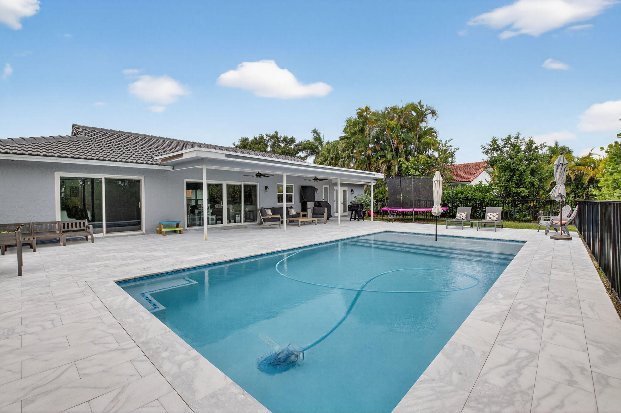 10302 Crosswind Road Boca Raton, FL 33498 - Photo 15 of 27 a view of a house with swimming pool